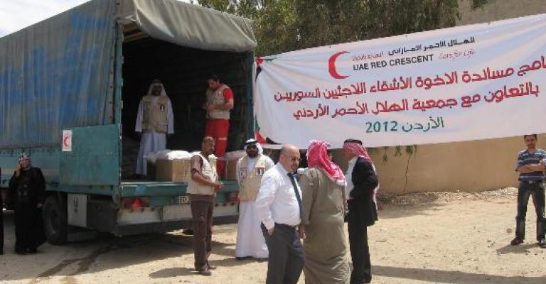 توزيع مساعدات عينية على الأسر السورية في معان