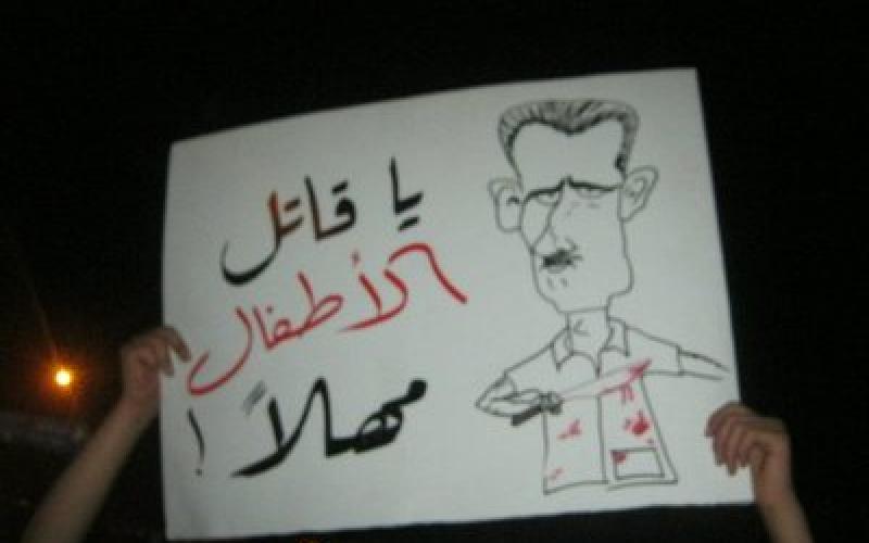 "صور" اعتصام شموع أمام السفارة السورية: شعب الأردن وسوريا وحدة حال